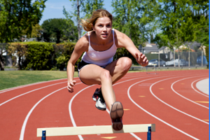 Women Jumping Hurdles